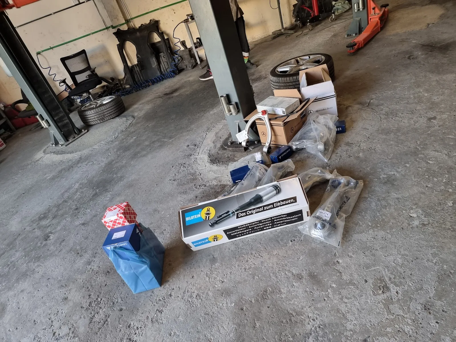 Branded replacement parts laid out on the workshop floor