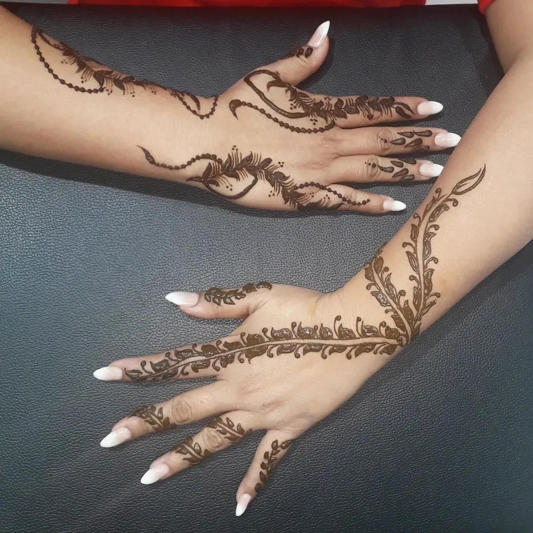 Detailed henna mehndi design on hands