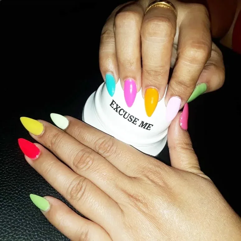 Bright neon gel polish nails done at the salon