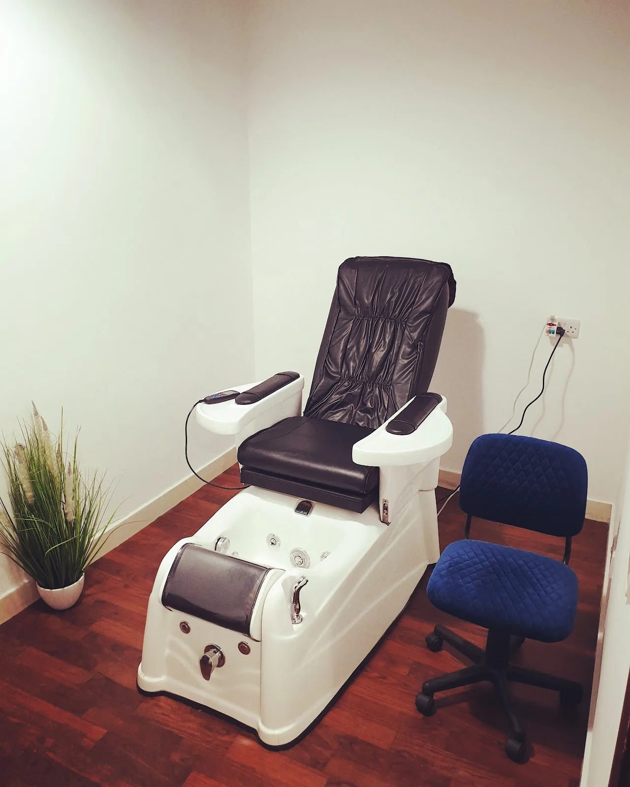 Pedicure and foot spa chair in a quiet private treatment room