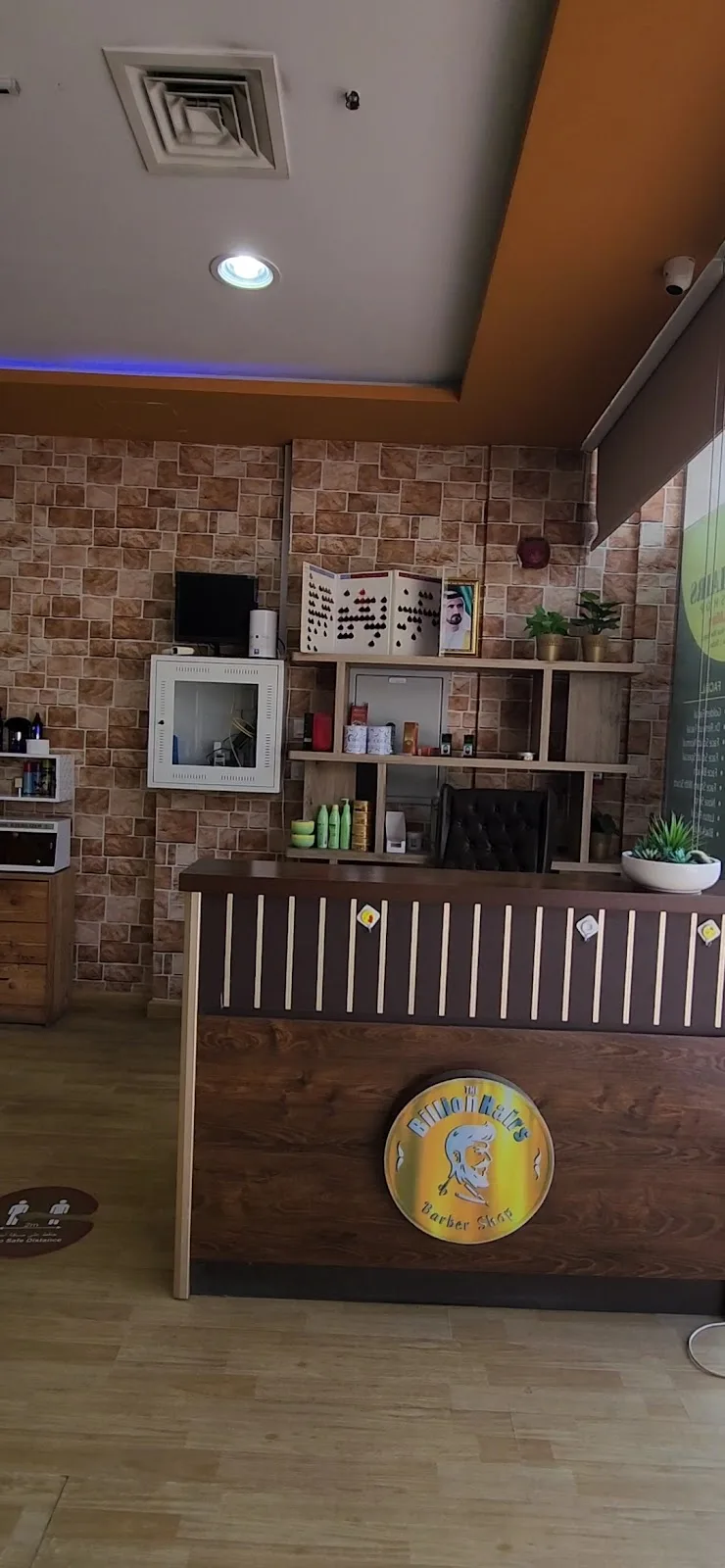Reception and welcome desk of The BillionHairs Barber Shop