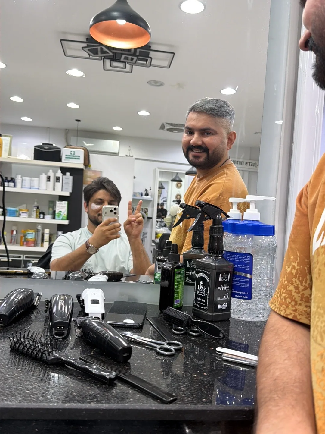 Barber's clippers, scissors and grooming tools laid out at the VOOM Gents Salon station