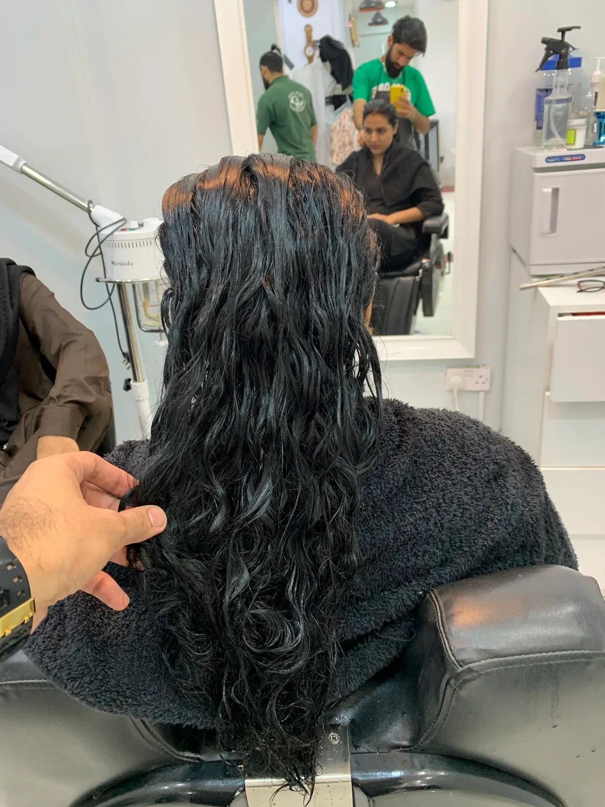Hair wash and conditioning treatment being carried out at VOOM Gents Salon