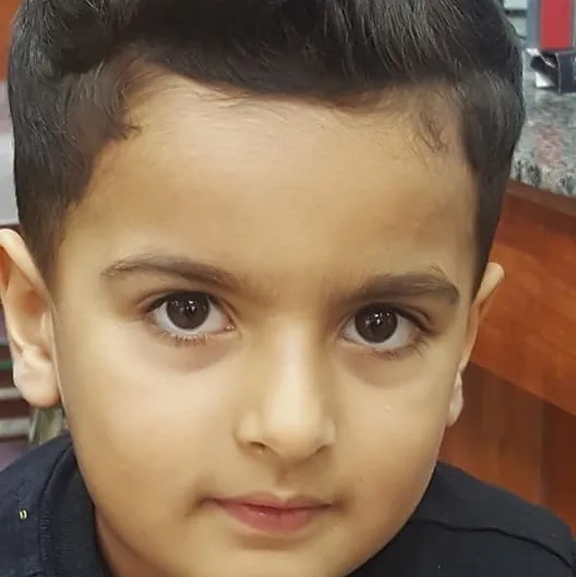 Young boy with a neat fresh haircut at VOOM Gents Salon