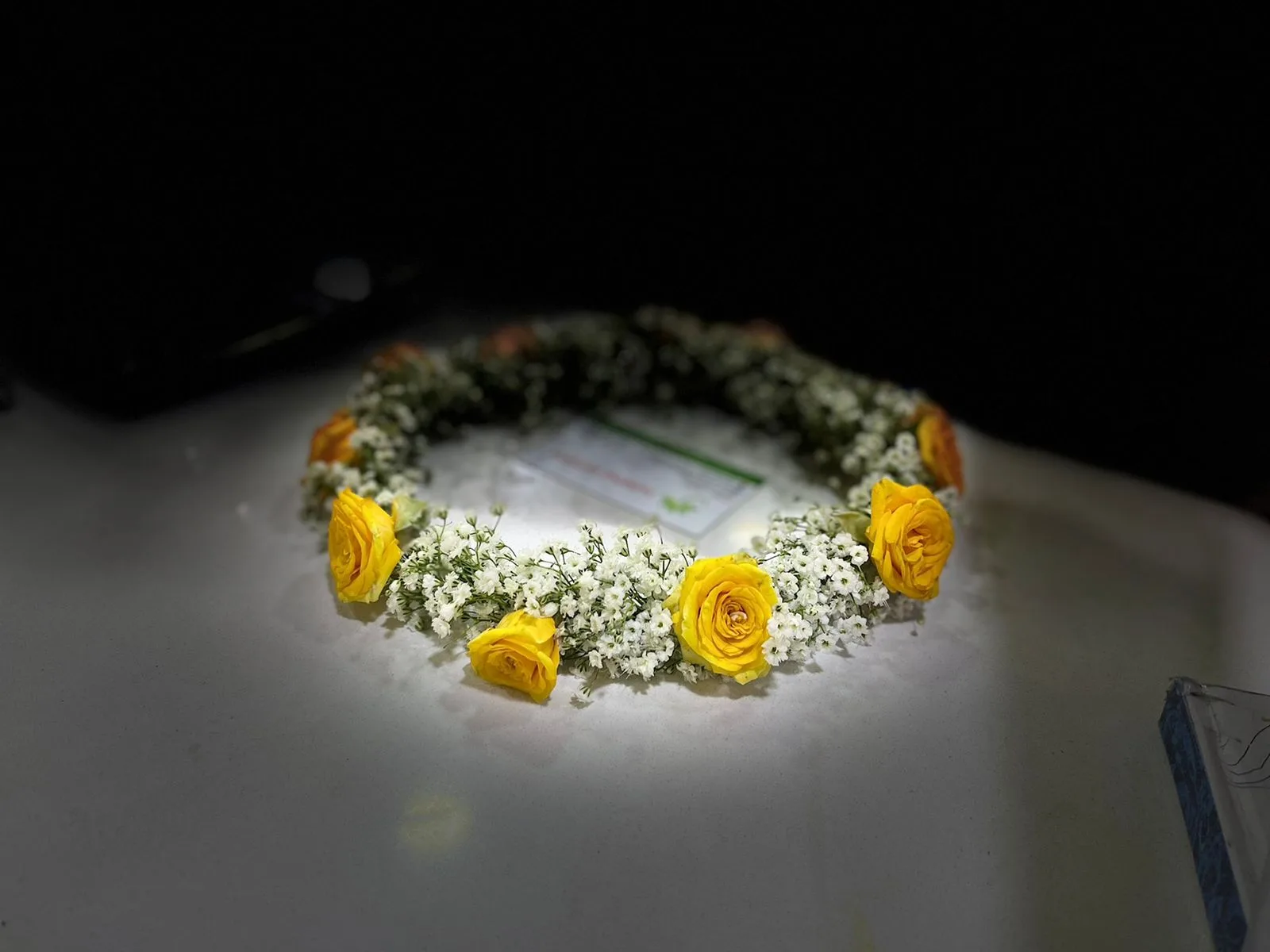 Flower crown of yellow roses and baby's breath