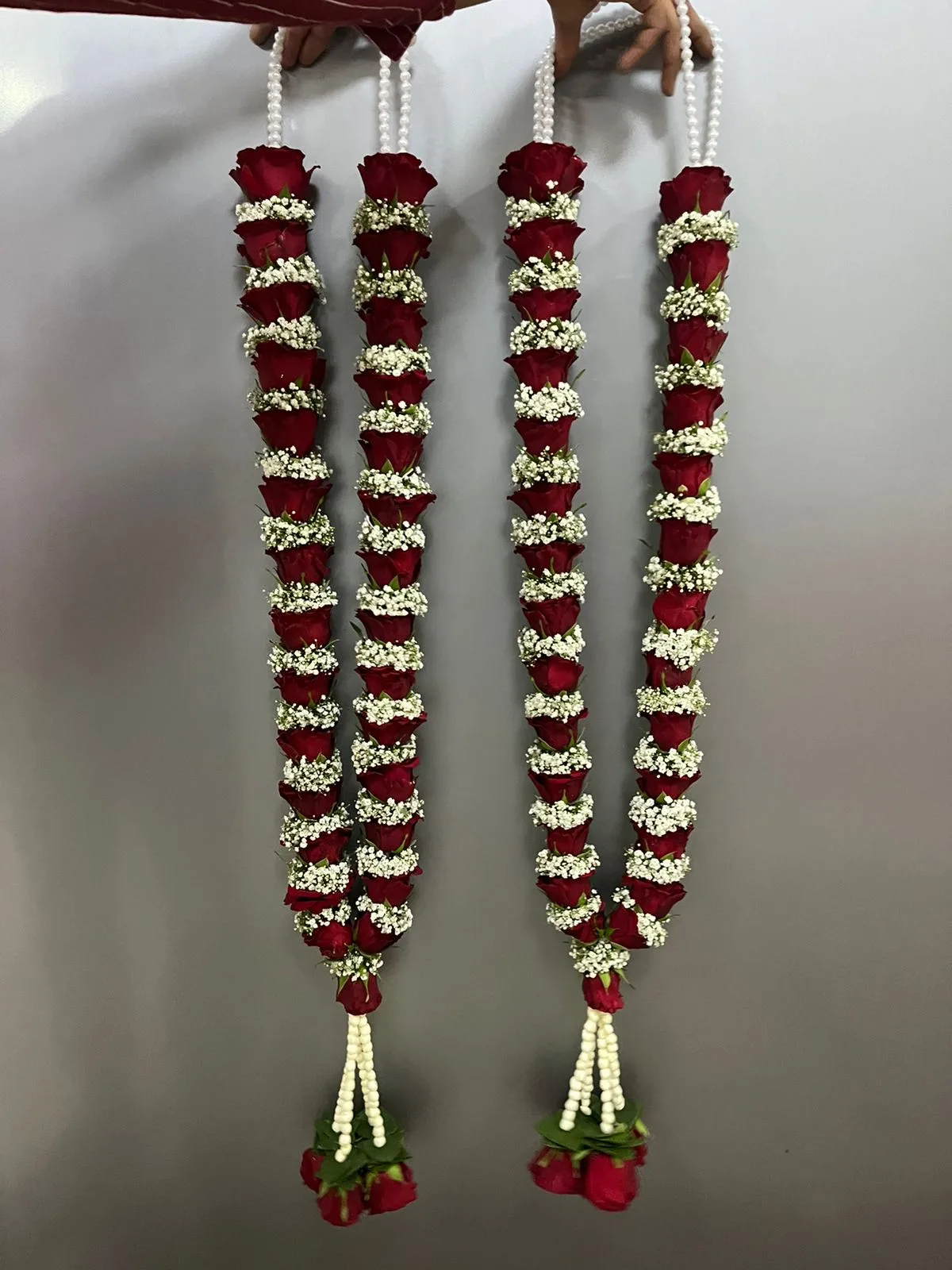 Red rose and gypsophila wedding garland pair with pearl strings