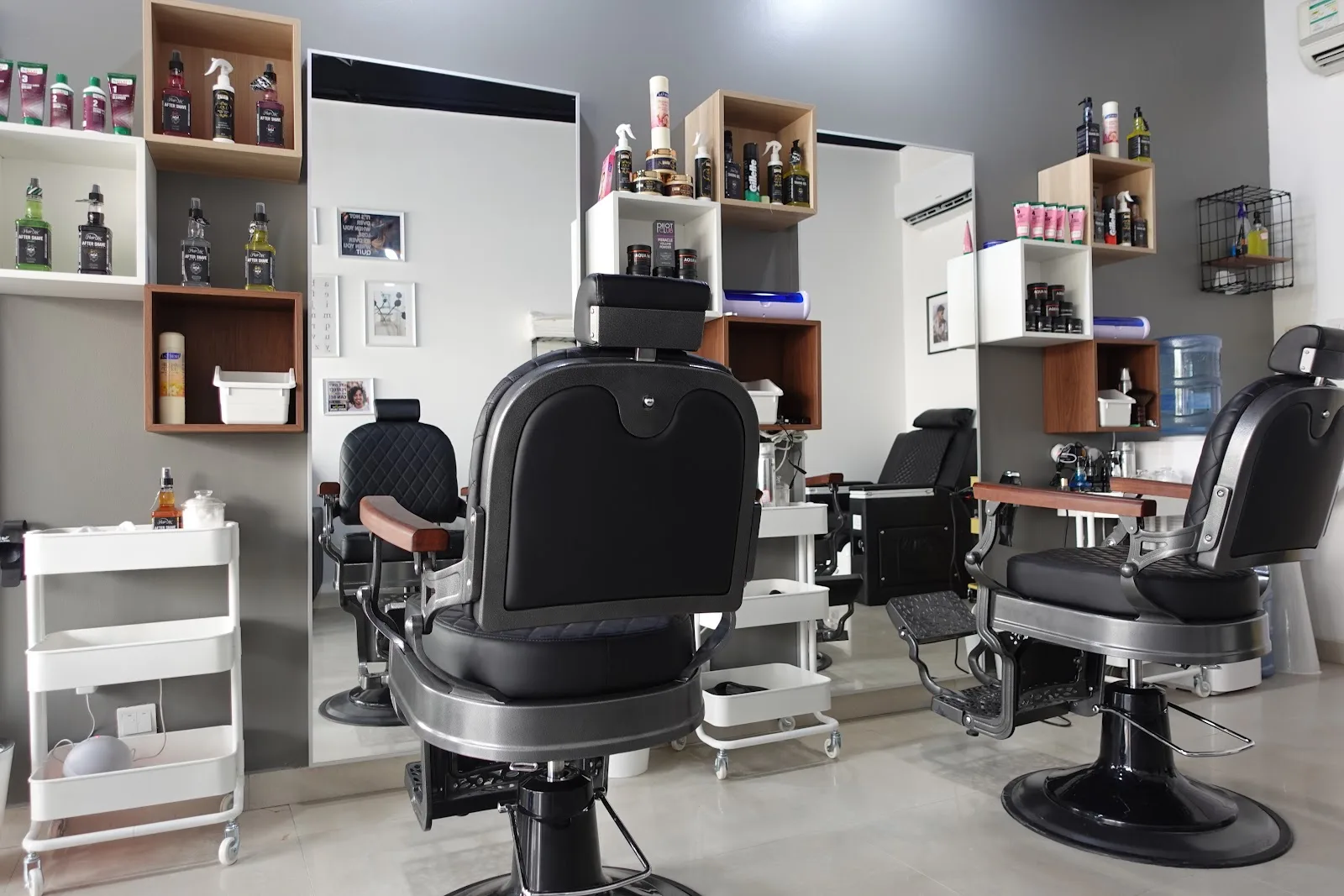 Barber chairs and styling stations inside Scissor & Style Gents Salon