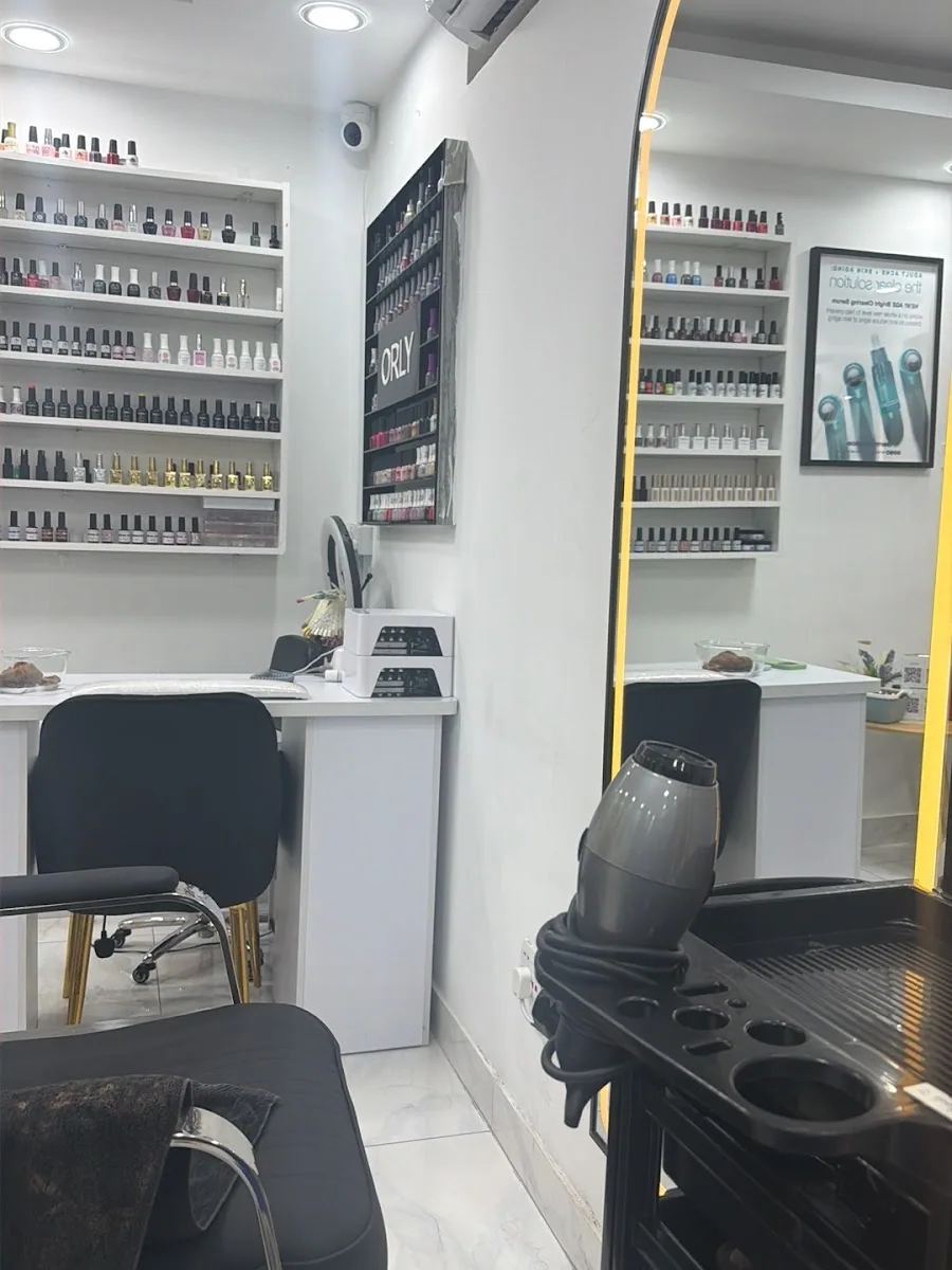 Polish wall and tidy manicure stations inside the salon