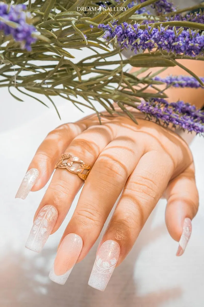 Long glitter ombre coffin nails styled with lavender