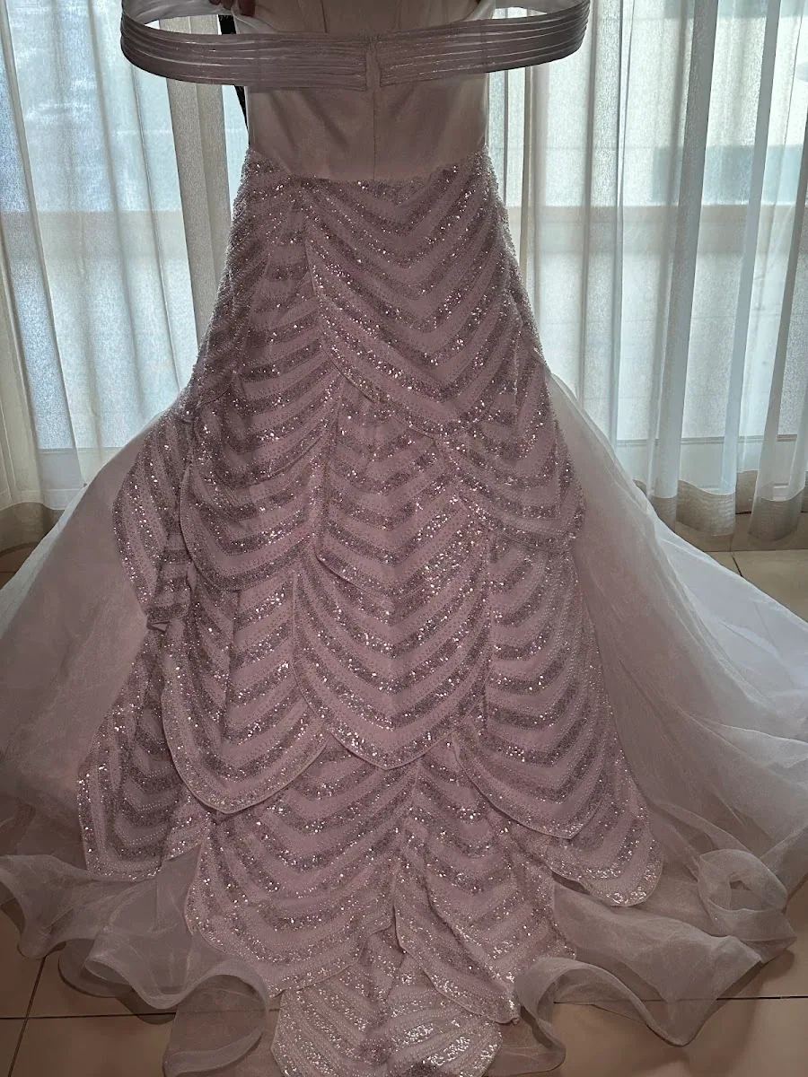 Close-up of pink sequin chevron beadwork on a gown