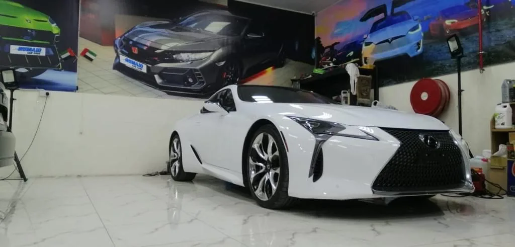 A white Lexus LC coupe freshly detailed