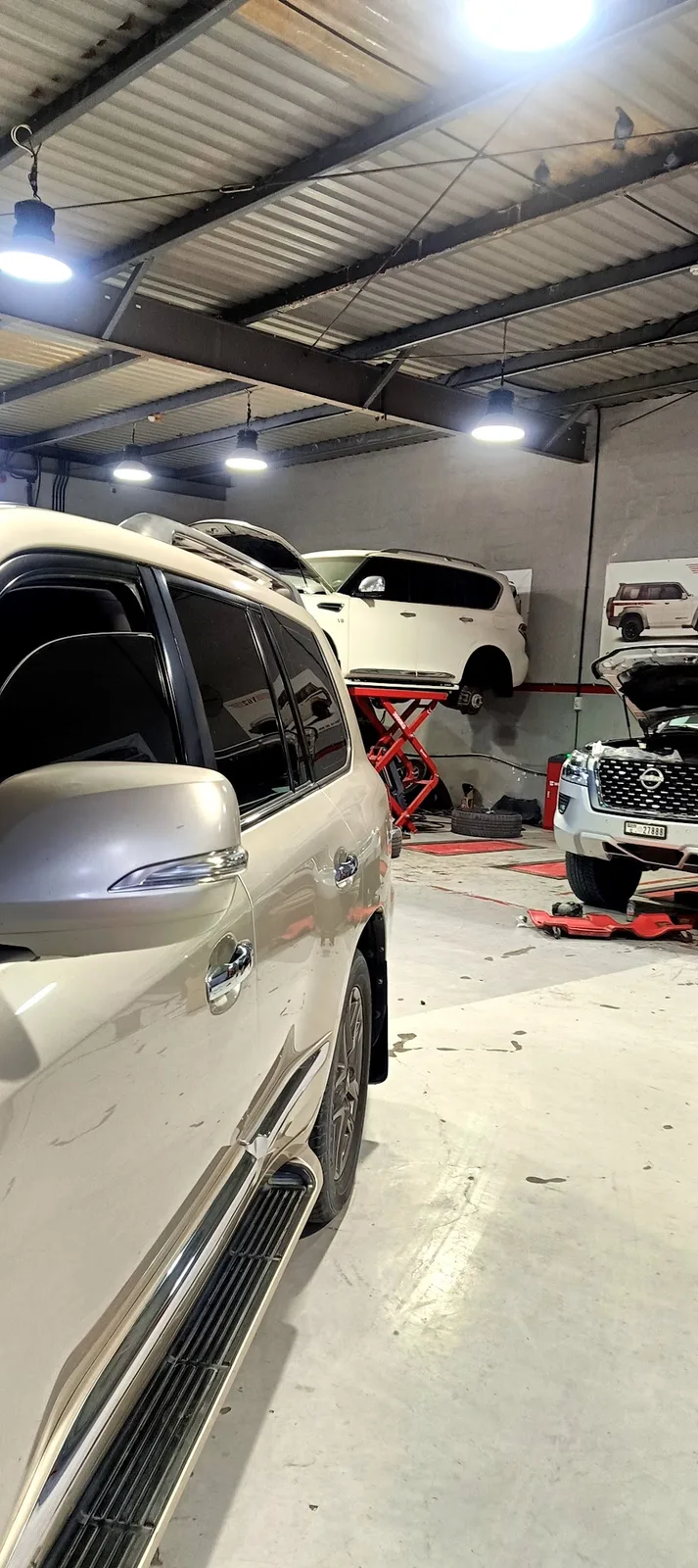 Nissan Patrol raised on a scissor lift