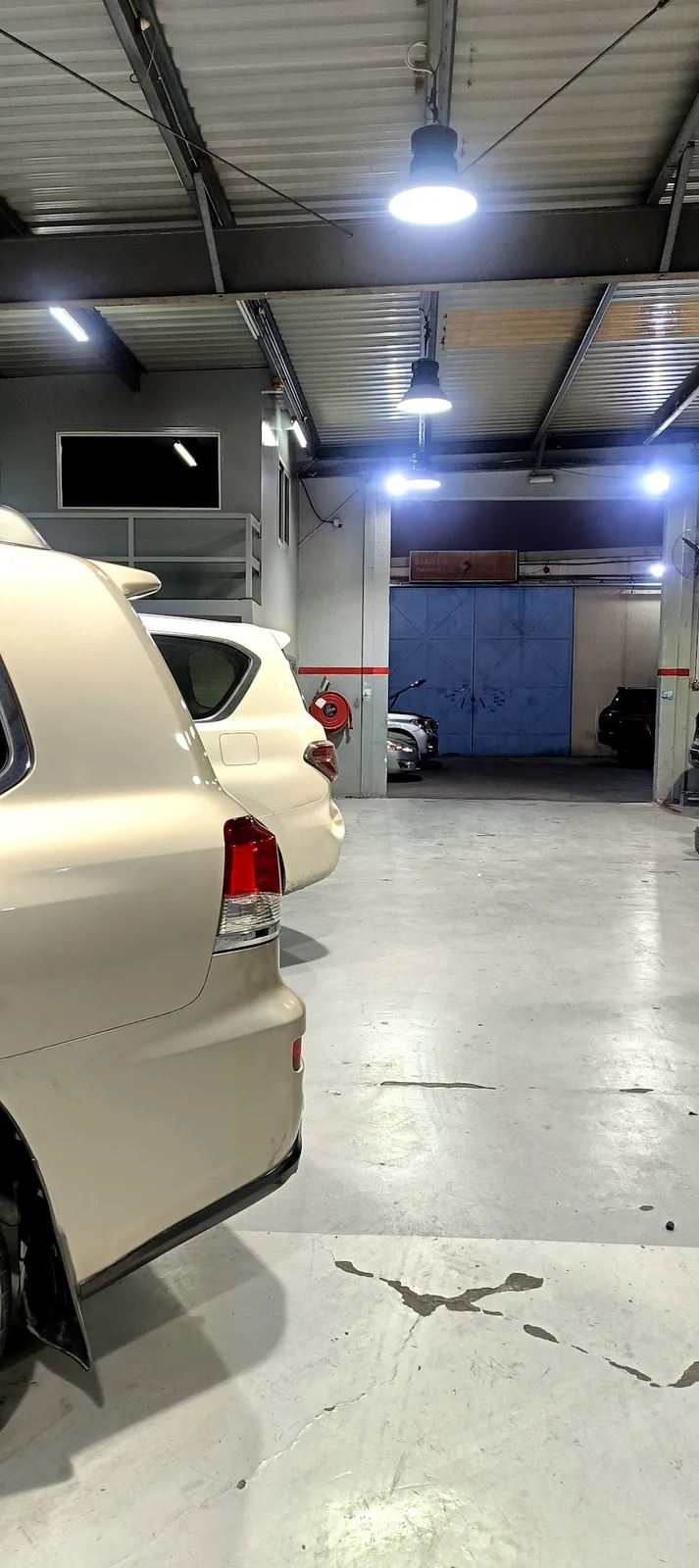 Interior bay with a parked SUV