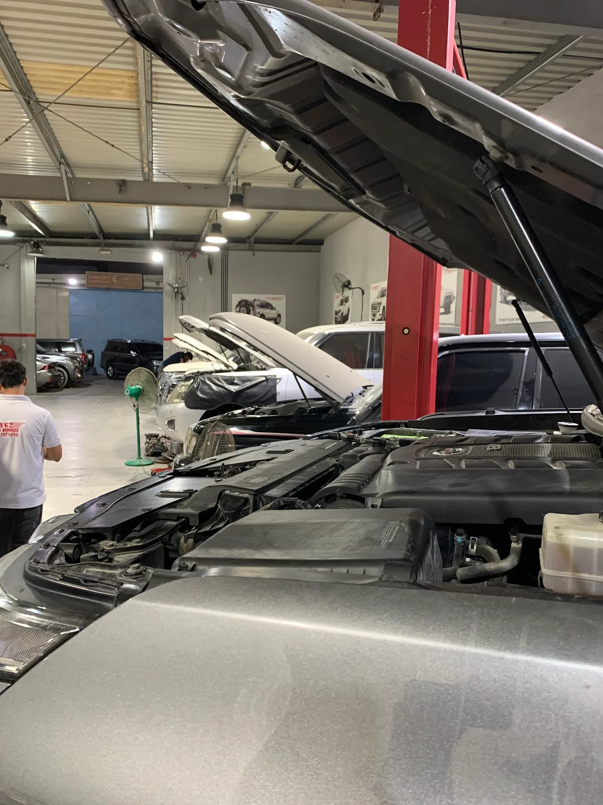 Open engine bay of an SUV under inspection