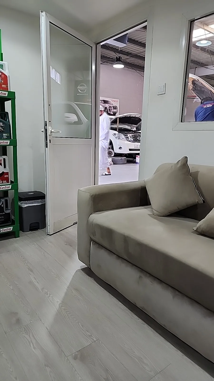 Customer waiting area with a sofa