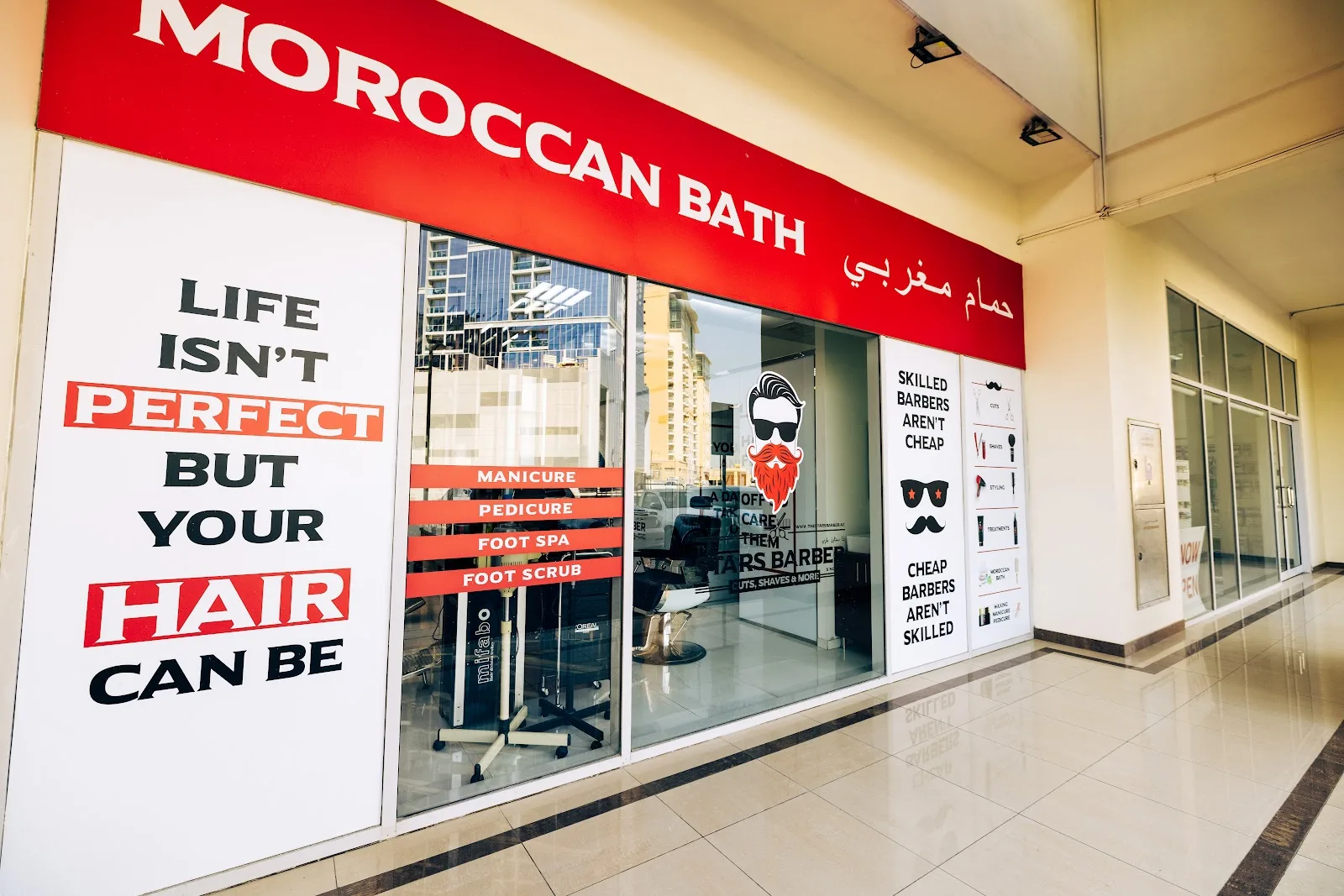 Red Moroccan Bath shopfront panel reading Life isn't perfect but your hair can be